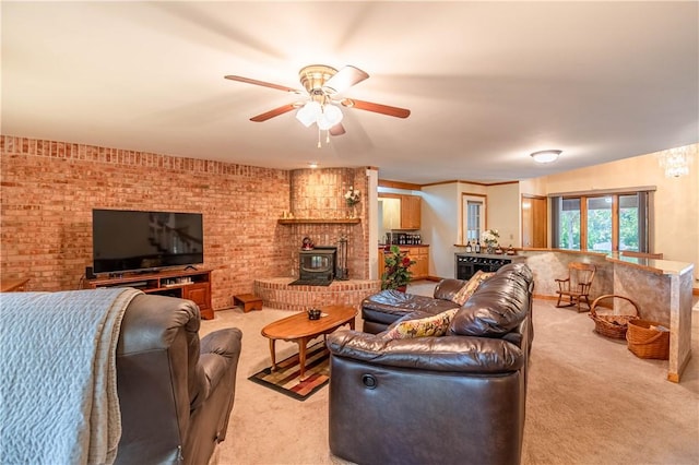 5353 E Reas Bridge Rd, Decatur, IL 62521 - living area featuring light colored carpet, ceiling fan, a wood stove, and brick wall