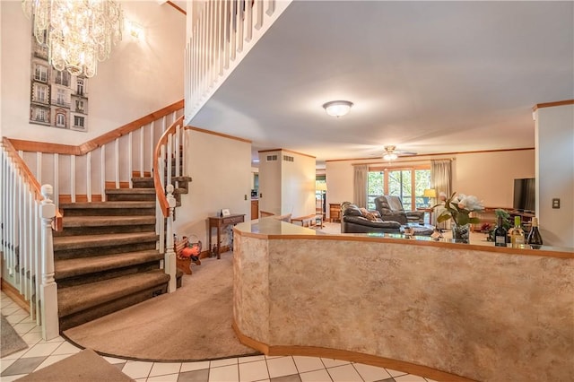 5353 E Reas Bridge Rd, Decatur, IL 62521 - living room featuring a ceiling fan, light tile patterned floors, stairway, light carpet, and crown molding
