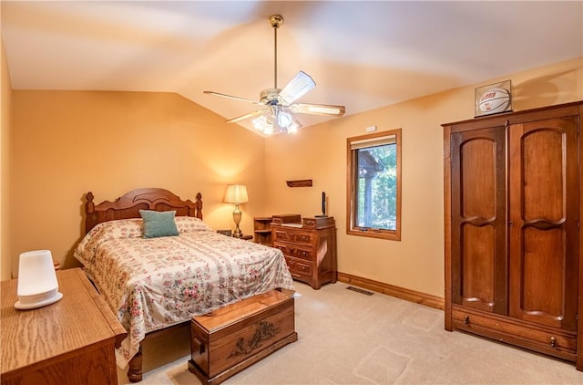 5353 E Reas Bridge Rd, Decatur, IL 62521 - bedroom with light carpet, lofted ceiling, a ceiling fan, and baseboards