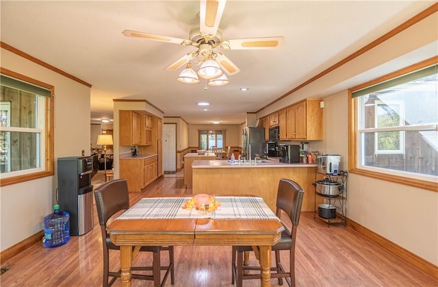 5353 E Reas Bridge Rd, Decatur, IL 62521 - dining room with light wood-style floors, baseboards, and ornamental molding