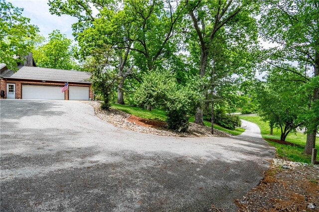 5353 E Reas Bridge Rd, Decatur, IL 62521 - view of front of home with driveway and an attached garage