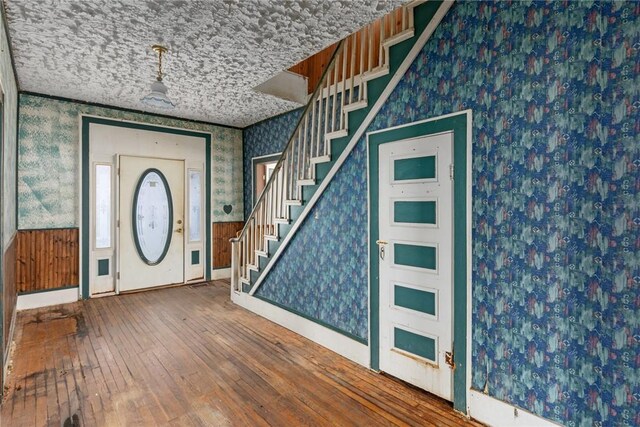 311 Lafayette St, Newton, IL 62448 - foyer featuring stairway, wood-type flooring, baseboards, and wallpapered walls