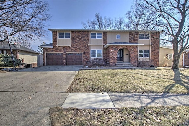 view of front facade featuring brick siding, an attached garage, a front yard, central AC, and driveway