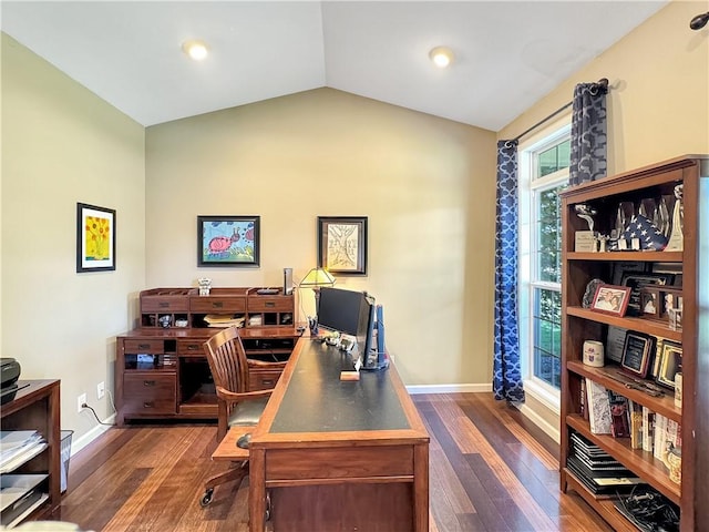 home office featuring vaulted ceiling, baseboards, and dark wood finished floors