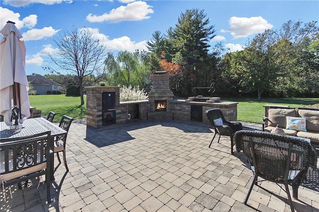 view of patio featuring an outdoor living space with a fireplace and outdoor dining space