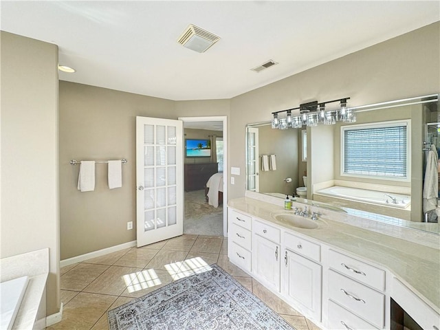 full bathroom with toilet, tile patterned flooring, visible vents, and ensuite bathroom