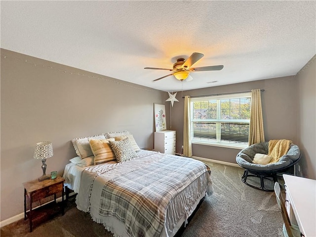 carpeted bedroom featuring a ceiling fan, a textured ceiling, and baseboards