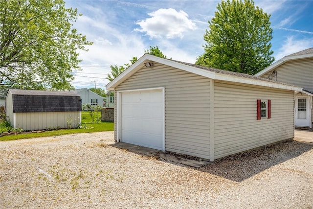510 N Merchant St, Effingham, IL 62401 - detached garage with driveway and a storage shed