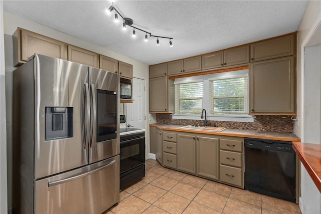 510 N Merchant St, Effingham, IL 62401 - kitchen with black appliances, a sink, light tile patterned floors, backsplash, and a textured ceiling