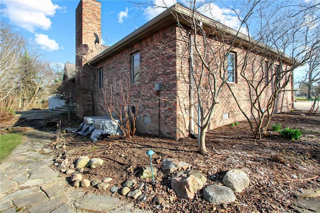 508 Deere Run Ln, Casey, IL 62420 - view of side of home with a chimney, brick siding, and crawl space