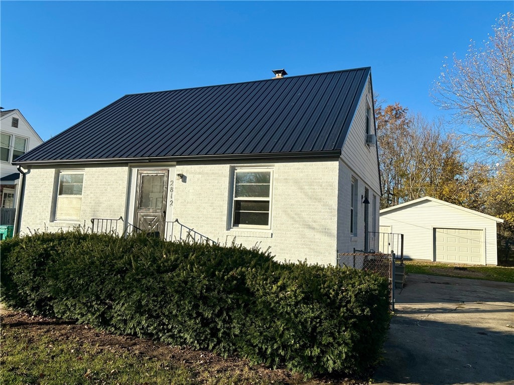 view of front of house with an outbuilding and a garage