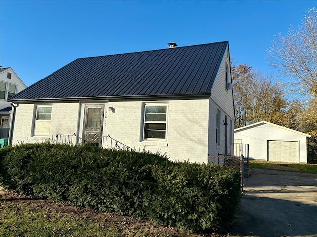 view of front of house with an outbuilding and a garage