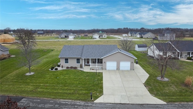 ranch-style house with a garage and a front yard