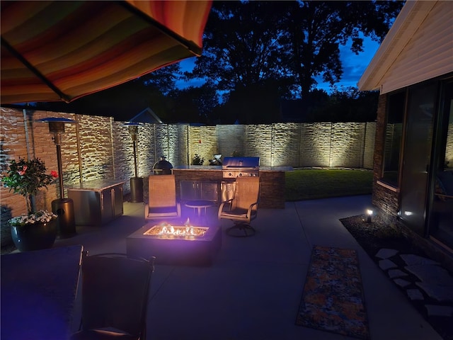 1003 Flame Ave, Effingham, IL 62401 - fenced backyard with an outdoor fire pit, a patio, and area for grilling