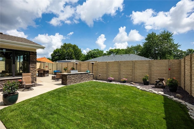 1003 Flame Ave, Effingham, IL 62401 - fenced backyard with a patio area