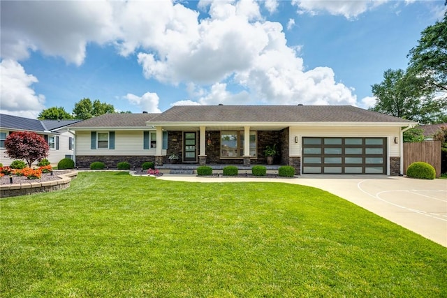 1003 Flame Ave, Effingham, IL 62401 - view of front of property with stone siding, an attached garage, concrete driveway, and covered porch