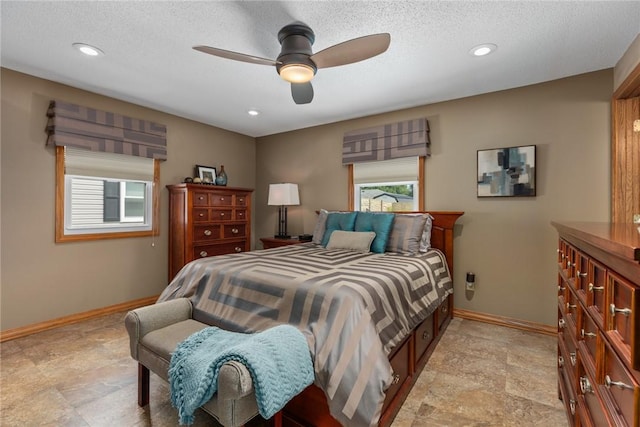 1003 Flame Ave, Effingham, IL 62401 - bedroom featuring ceiling fan, stone finish floors, recessed lighting, and a textured ceiling