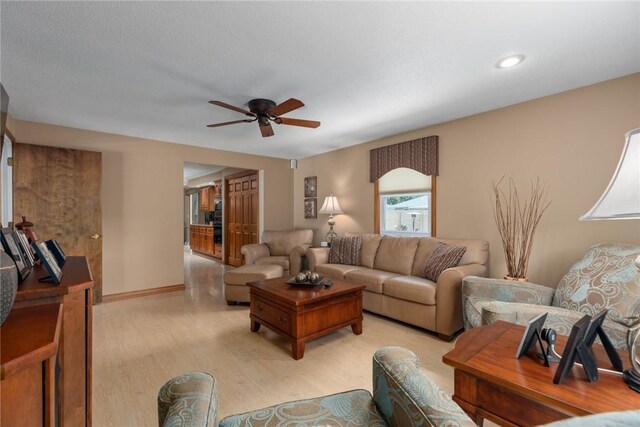 1003 Flame Ave, Effingham, IL 62401 - living room featuring a ceiling fan and light wood-style floors
