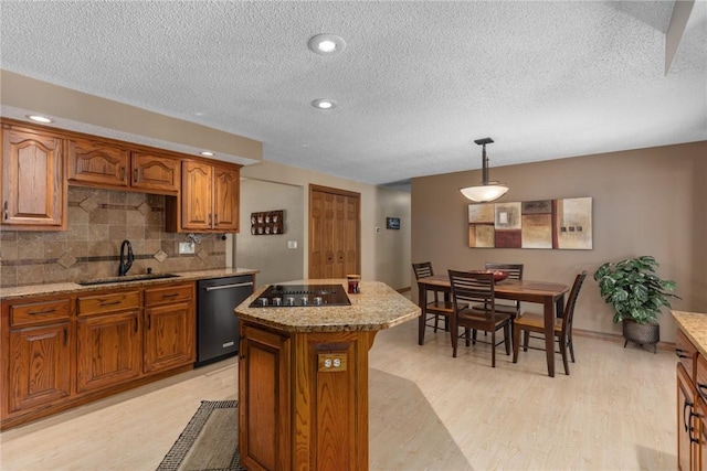 1003 Flame Ave, Effingham, IL 62401 - kitchen with dishwasher, black electric cooktop, brown cabinets, decorative backsplash, and a textured ceiling