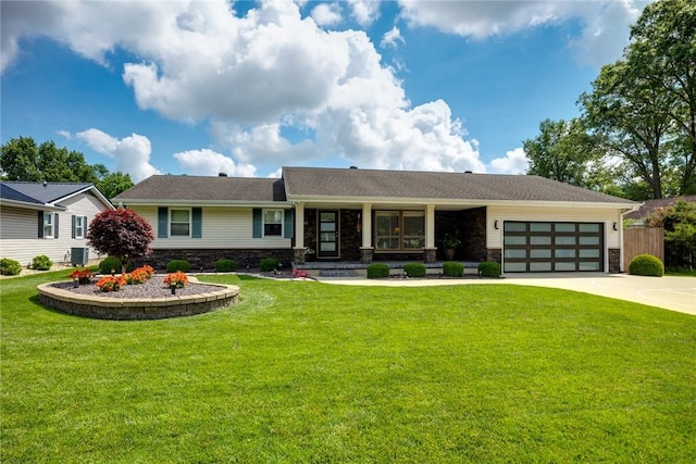 1003 Flame Ave, Effingham, IL 62401 - view of front of house featuring stone siding, an attached garage, driveway, and covered porch