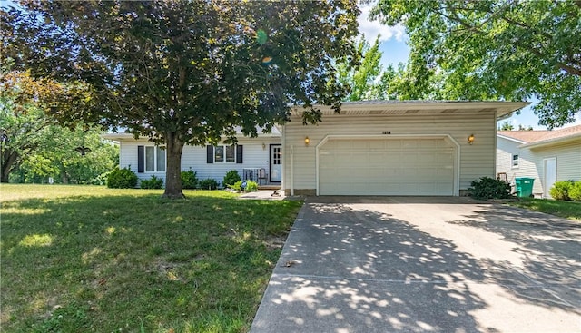 1059 Columbia Dr, Decatur, IL 62522 - single story home featuring concrete driveway, a garage, and a front yard