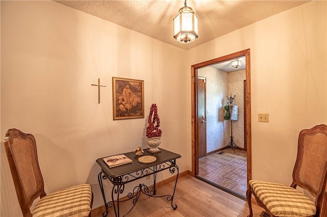 1059 Columbia Dr, Decatur, IL 62522 - corridor with light wood-type flooring and a textured ceiling