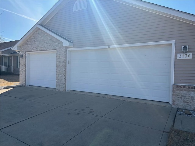 garage featuring driveway