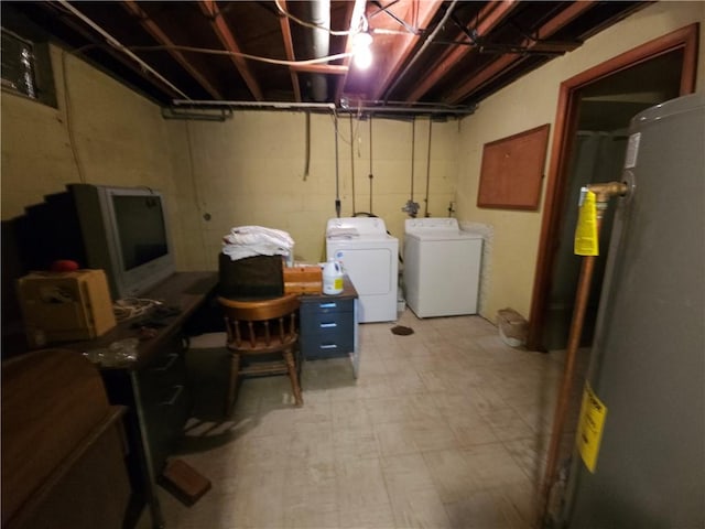 unfinished basement featuring water heater, light floors, and separate washer and dryer