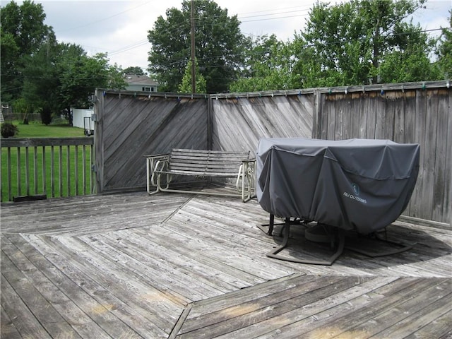 517 Coolidge Ave, Charleston, IL 61920 - wooden deck with a grill and a yard