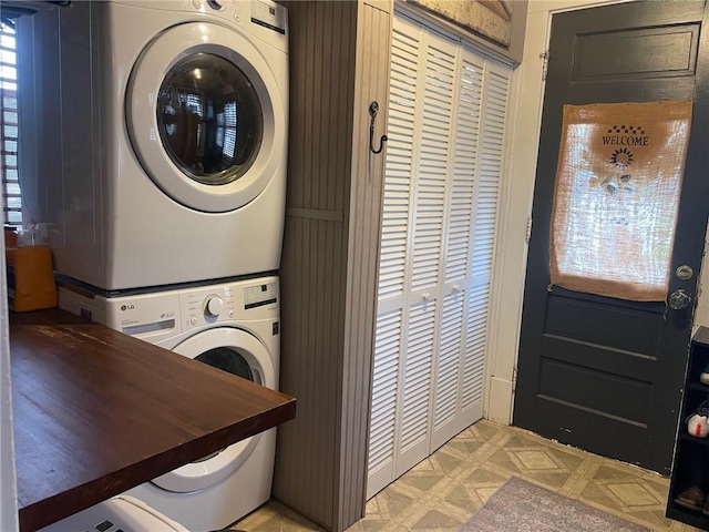 laundry room with laundry area and stacked washer and dryer