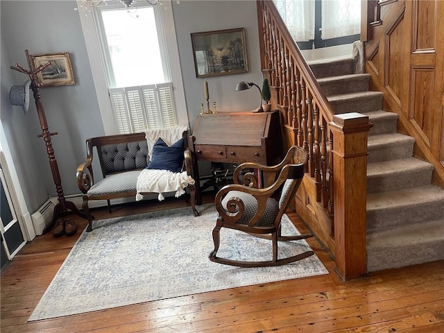 sitting room featuring hardwood / wood-style floors and stairway