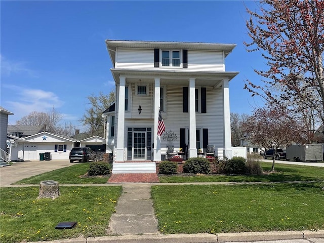 greek revival inspired property featuring covered porch and a front yard