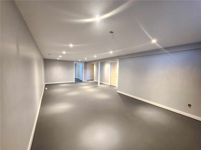 finished basement featuring baseboards and recessed lighting