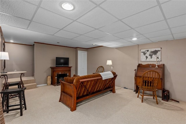 living area featuring carpet floors, recessed lighting, and a paneled ceiling