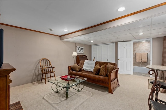 carpeted living room featuring recessed lighting and ornamental molding