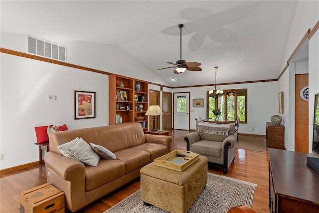 living room with visible vents, vaulted ceiling, wood finished floors, baseboards, and ceiling fan with notable chandelier