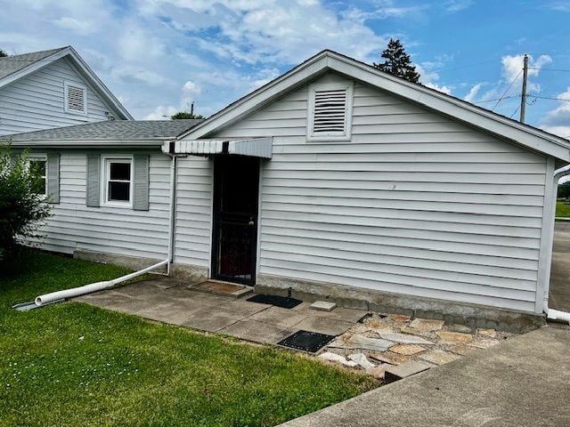311 E Collett St, Oakwood, IL 61858 - back of property featuring a shingled roof
