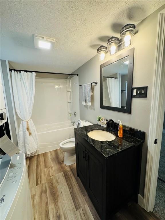1404 N 24th St, Decatur, IL 62526 - full bath featuring vanity, toilet, wood finished floors, shower / bathtub combination with curtain, and a textured ceiling
