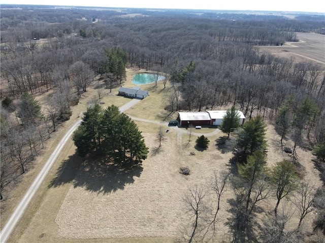 bird's eye view with a rural view and a wooded view