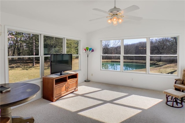 sunroom / solarium with lofted ceiling and a ceiling fan