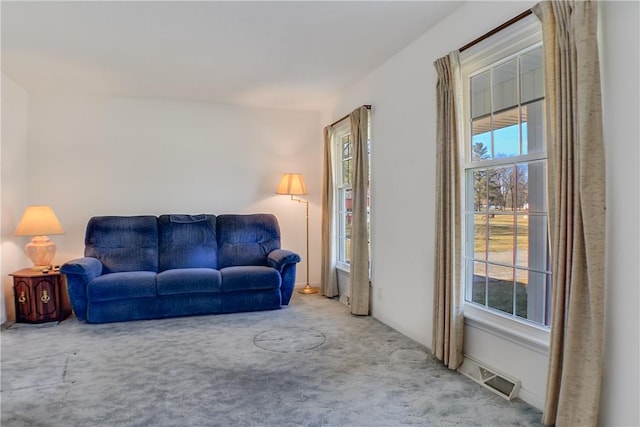 carpeted living area with visible vents