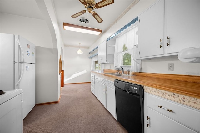 801 N Central Ave, Paris, IL 61944 - kitchen featuring dishwasher, light carpet, a ceiling fan, white cabinetry, and crown molding