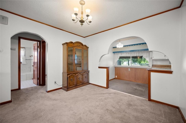 801 N Central Ave, Paris, IL 61944 - unfurnished room with a chandelier, crown molding, carpet flooring, and a textured ceiling