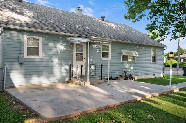 801 N Central Ave, Paris, IL 61944 - back of property featuring a chimney, a patio area, and roof with shingles