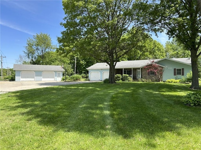 3002 N Charlotte St, Effingham, IL 62401 - single story home with a detached garage and a front lawn
