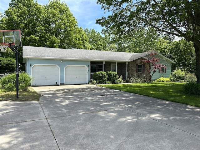 3002 N Charlotte St, Effingham, IL 62401 - single story home with an attached garage, a front lawn, and concrete driveway