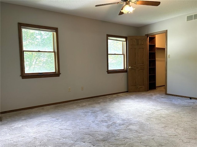 3002 N Charlotte St, Effingham, IL 62401 - carpeted empty room with a ceiling fan and baseboards