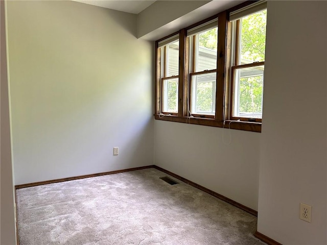 3002 N Charlotte St, Effingham, IL 62401 - unfurnished room with carpet flooring, baseboards, and plenty of natural light