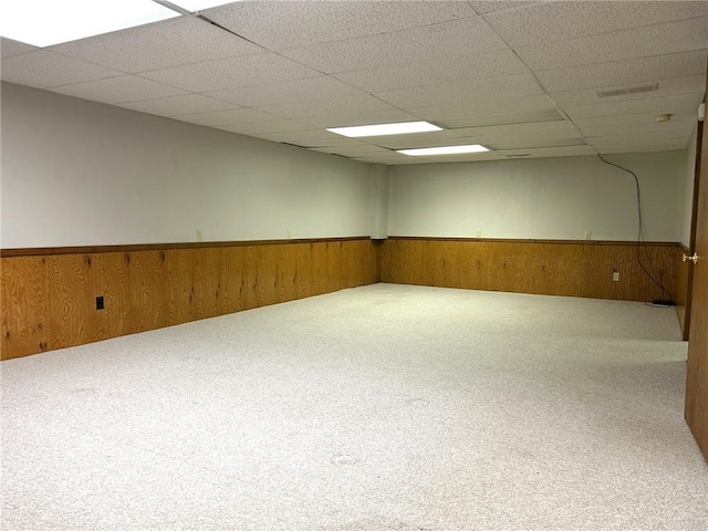 3002 N Charlotte St, Effingham, IL 62401 - spare room with carpet floors, wainscoting, a drop ceiling, and wooden walls