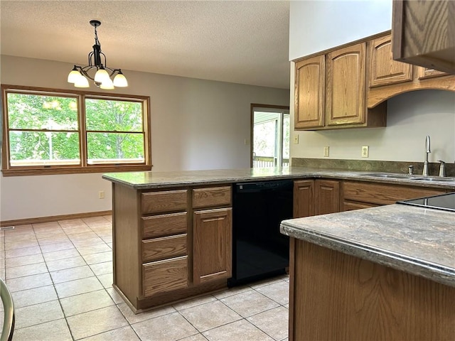 3002 N Charlotte St, Effingham, IL 62401 - kitchen with black dishwasher, a peninsula, dark countertops, a sink, and a textured ceiling